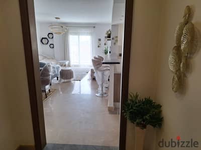 شقة مفروشة للإيجار في أب تاون كايرو إعمار بموقع مميز على حمام سباحة فيو Uptown Cairo Emaar