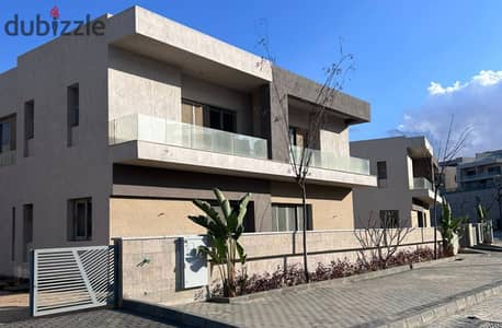 Semi-finished twin house villa for sale, ready to move, in Hadaba Compound, minutes from Sheikh Zayed