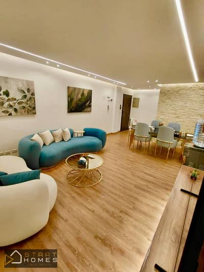 Luxury 3-bedroom, 116-square-meter furnished apartment for rent in Madinaty (B10), featuring custom finishes and a fully equipped kitchen.