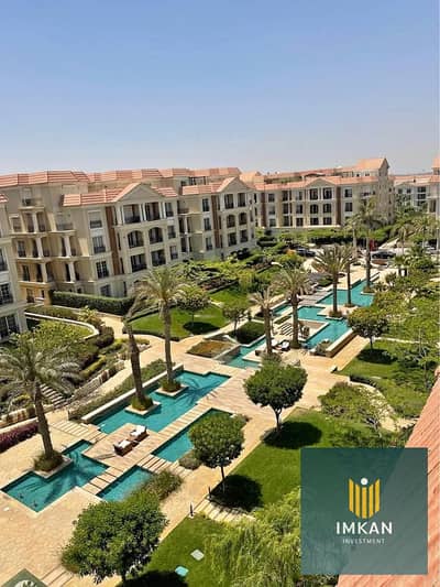 Apartment for sale in Golden Square—specifically in the Regents Square and Regents Park compounds in New Cairo (Fifth Settlement)—featuring a pool vie