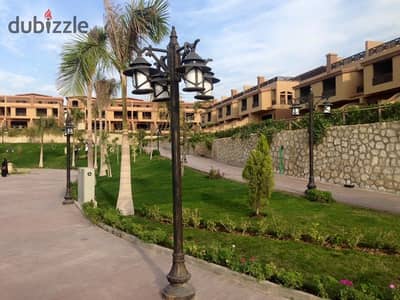 An exceptional twin house for sale in a prime location within the Pyramids Walk compound.
