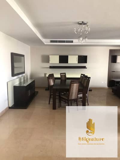Furnished apartment for rent, super deluxe finishing, in Cairo Festival City compound, New Cairo, with an open view overlooking the landscape.