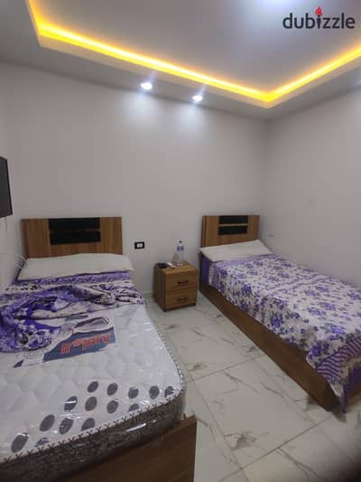 Studio available in 6th of October City, 1st district adjacent to Al-Khamseh, first upper floor, includes water and electricity, minutes to Al-Hosari Mosque, close to all services.