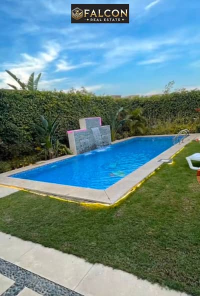 Villa ready for immediate handover at Taj City, featuring a private pool, hotel-style finishing, and an elevator. Located in the front row along Suez