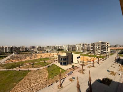 140m² ultra-modern apartment for sale in Janna Zayed 2; features a landscape view and a prime location; includes kitchen and air conditioning units. .