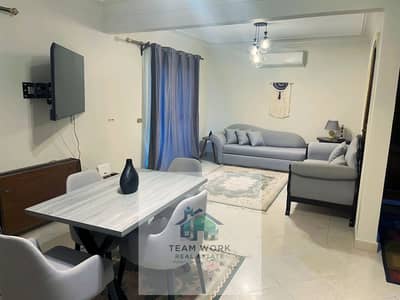 Upscale rental with a private garden. . . Fully furnished apartment in "Hadaeq Al Mohandeseen Compound"!