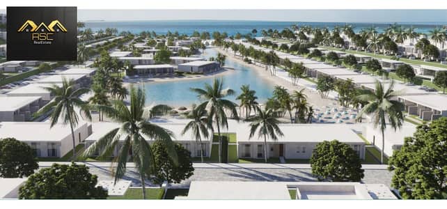 Ground-floor chalet with a garden for sale in Zone K at Salt Ras El Hekma, North Coast. It features a stunning sea view, is situated in the second row