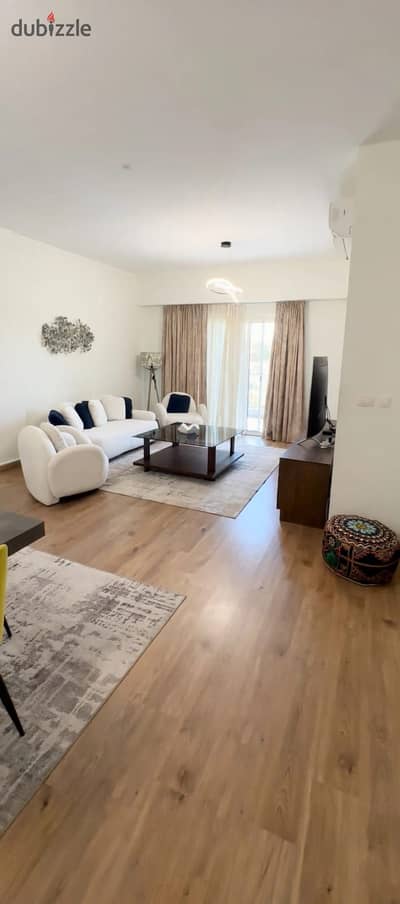 An apartment with a large area furnished in a modern style in the most distinguished and best compound in the Fifth Settlement Mivida, specifically Mivida Boulevard, near Al-Teseen Street