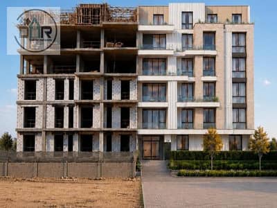 Own your apartment on an installment plan in a Sheikh Zayed compound next to HyperOne; delivery in two years, with 30% construction progress.