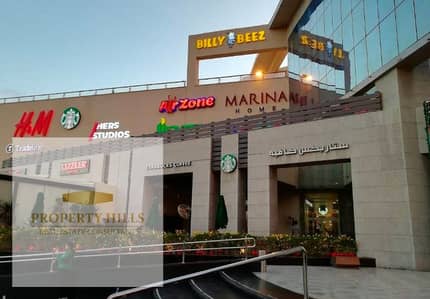 Shop for sale opposite the American University, installments over 7 years in Fifth Settlement