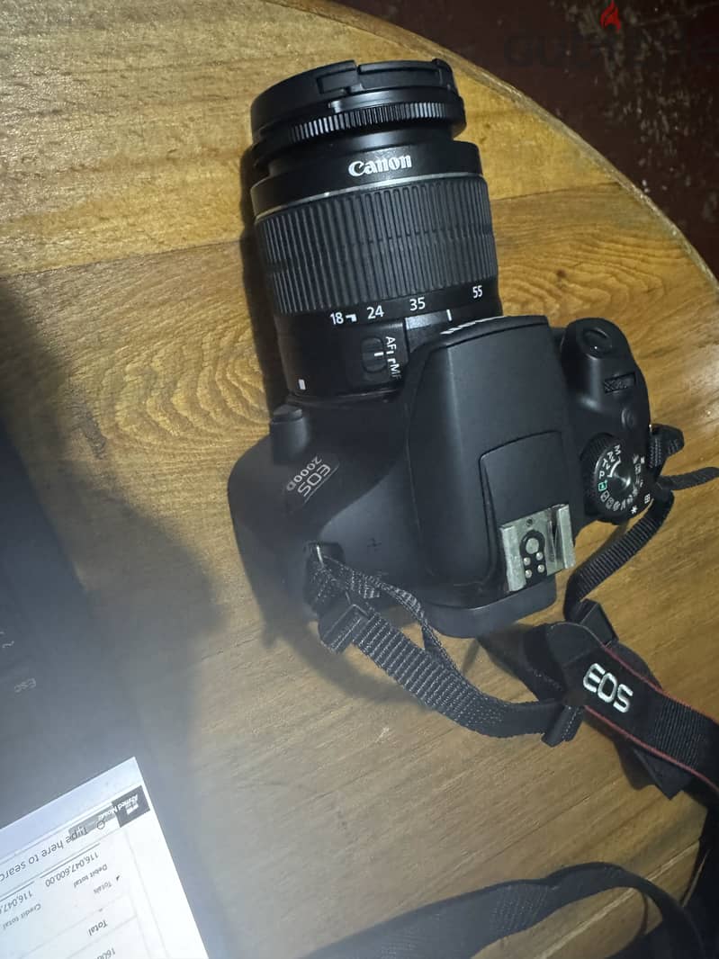 Camera EOS 2000 D with cover and memory card 2