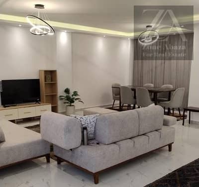 Ground floor apartment for rent with garden, fully furnished, ultra-super-lux, in Stone Residence Compound, Katameya, Cairo. Two bedrooms, kitchen, an