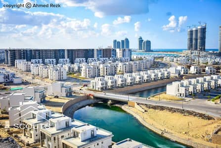 Immediate receipt apartment on the sea and lagoon in New Alamein, live and invest with the highest return in front of Alamein Towers, directly in Mazarine North Coast