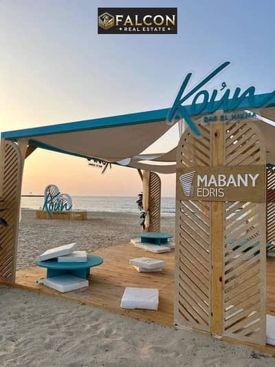 Chalet with pool and lagoon views in Ras El Hekma—48% discount, steps from the sea, ready for immediate handover, and fully finished.