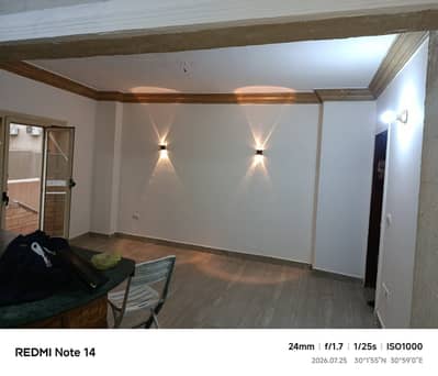 Apartment for rent in Sheikh Zayed's 7th District: ground floor with a garden, prime location, and a wonderful view.
