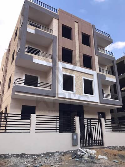 Apartment for sale in Al-Narges—ready for immediate move-in—priced at half-value for a quick sale; features a distinctive view overlooking a private g