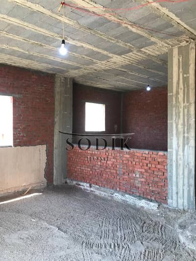 Apartment with an 18-month installment plan and immediate occupancy in the fourth district, on Arabi Farms, with a garden view.