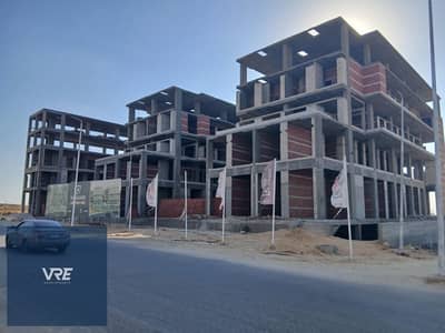 A 53-square-meter commercial space is for sale in Al Shorouk, directly on Al Horreya Axis, next to Carrefour and the British School.