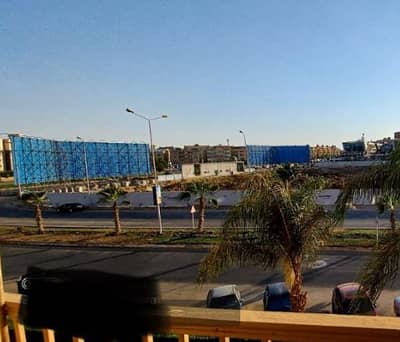 For sale, an Ultra Super Lux apartment in front of The Gate Mall – Sheikh Zayed, finishes and preparations: high-quality PARADOR HDF flooring, GROHE kitchen mixer, Ideal Stand bathroom mixers.