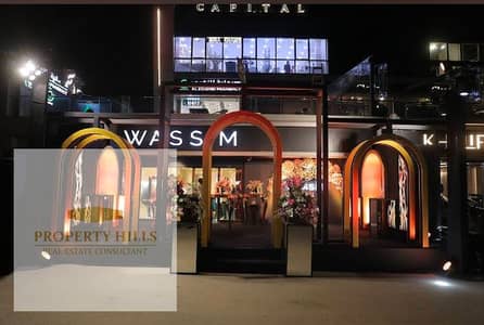 Last shop for sale, currently rented for 180,000 per month, with a street-facing storefront in Fifth Settlement.