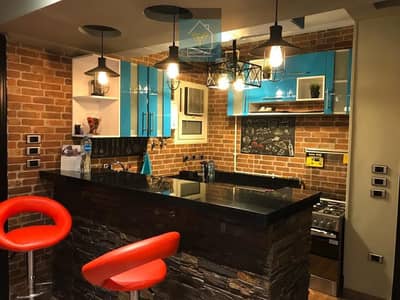 Apartment for sale with kitchen in Sheikh Zayed, Al-Mustaqbal buildings, second floor after the ground, directly on the main street.