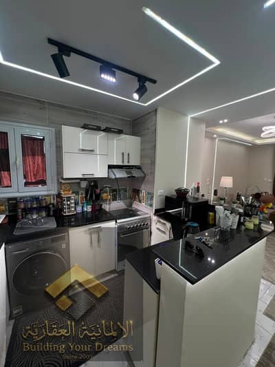 Apartment for rent furnished in Al-Ashrafiya Compound next to Water Way and Garden 8 and Al-Rehab and North and South Thirteen Street and minutes to the American University and Future University