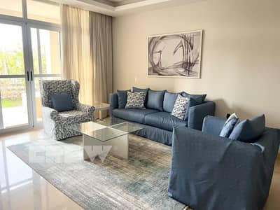 Two-bedroom apartment with a private garden for rent in Cairo Festival City; features ultra-super-lux finishes and an optimal layout. Ready to move