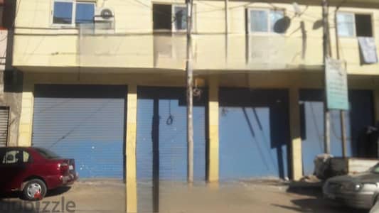 محل بثلاث أبواب واجهة كبيره في محرم بك