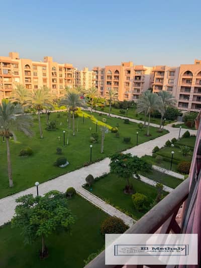 Freehold apartment for sale in Al Rehab City, New Cairo, with a wide garden view.