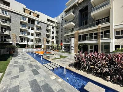 Own an apartment with a garden, ready for immediate occupancy,for sale in a prime location in New Cairo, near Madinaty and minutes from the Suez Road,