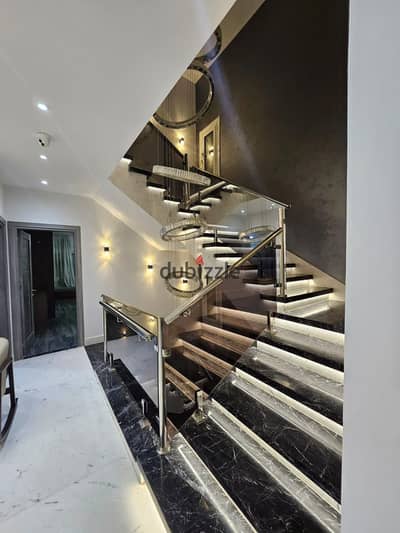 Fully finished villa for sale by Hassan Allam, located directly on North 90th Street—adjacent to the American University (AUC), the Grovva compound
