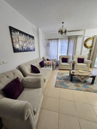 Furnished 2-bedroom apartment for rent, price 25,000 (currency unspecified), steps away from services.
