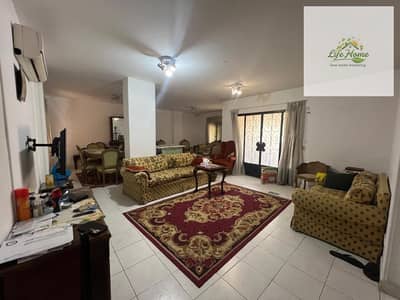 Ground floor apartment with a private garden for rent in Al Rehab, fully furnished