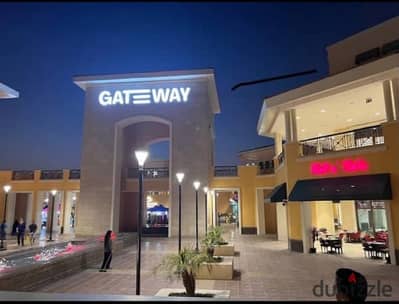 Commercial unit for sale in Gateway Mall super lux finishes excellent investment leased Area 22 sqm commercial activity in Al Rehab