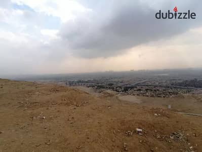 قطعه ارض ٦٠٠٠ م للبيع كمبوند سكني بالهضبه الوسطي المقطم