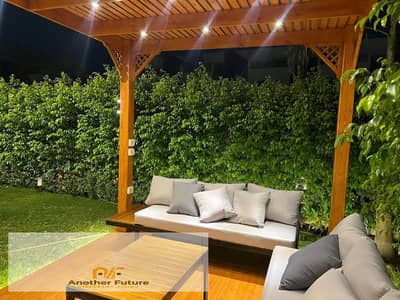 Immediate delivery: an exceptional apartment with a garden in a prime compound next to New Giza.