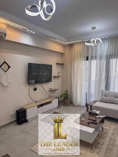 Furnished hotel-style apartment for rent in the Privado compound, Madinaty; garden view.