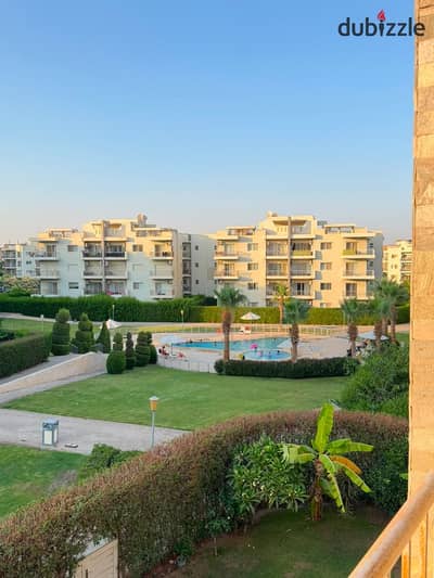 Apartment for rent in The Address Compound, Sheikh Zayed City. 78 sqm interior area with a 120 sqm garden. Includes kitchen cabinetry and air conditioning in the reception area.