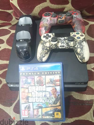 ps4 Slim ( 1 TB ) حالة ممتازه متفتحش علية ألعاب كتير ومعاه gta premium