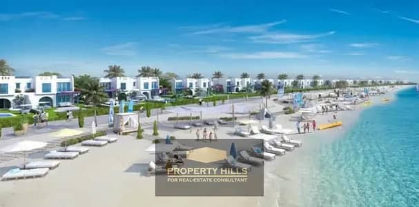 Own a fully finished two-bedroom chalet on the first line of the sea in the best location in Ras Al Hikma, next to Mountain View and SODIC.