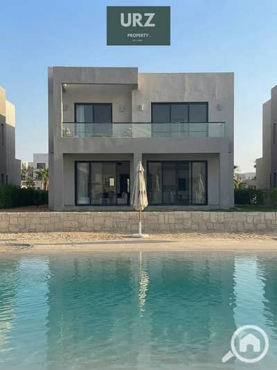 Villa with panoramic view of the sea and lagoon 5 rooms + private pool and fully finished with air conditioning for installment in Ras Al Hikma North Coast near Dus Seasons Marassi for sale