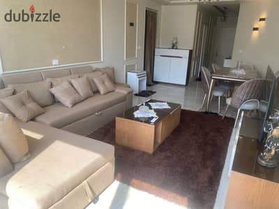 Furnished apartment in the compound One Katamia with two bedrooms and 2 bathrooms directly on the Maadi ring road. The compound is located in a distinguished location, featuring swimming pools, large green areas, and a playground for children. There is also a Starbucks, and all services are available. Additionally, the compound is fully surrounded by security.