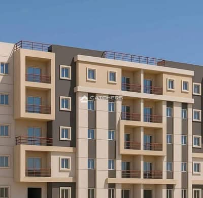 Apartment for sale with a garden in a prime location in Heliopolis, Isola Compound, with a 48% discount for cash payment.
