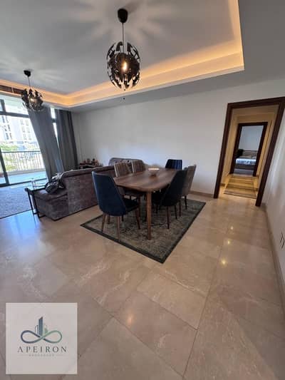 Luxury 156 sqm first-floor apartment in Ora Cairo Festival, overlooking landscaped gardens. Features 2 master bedrooms with en-suite bathrooms (one wi
