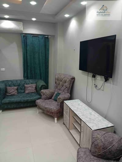 Furnished apartment for rent in Zahra Al-Maadi, Fifty Street, steps away from Fifty Mall. Premium and elegant location close to all restaurants, brands, and services. The rental price includes all services.
