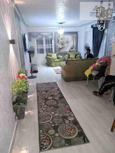 For rent, a furnished apartment in the new Awqaf buildings, Arab Al-Maadi, service location, and close to the Arab bus stop, fully air-conditioned.