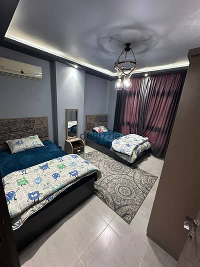 Furnished apartment in Compound One Qatamiya three rooms and a bathroom on the Maadi ring directly the compound is in a distinguished location it has swimming pools and also has large green spaces and has a children's playground and also there is Starbucks and all services are available and the compound is completely surrounded by security