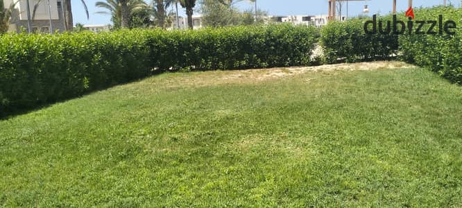 شالية ارضي بحديقة للبيع قرية امواج الساحل الشمالي