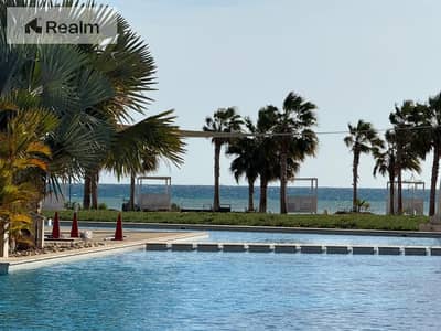 own your ready to move, sea and pool view apartment in the closest area to the sea
