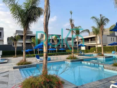 Corner villa for sale with a view of the landscape next to Al Ahly Club in Patio Zahraa
